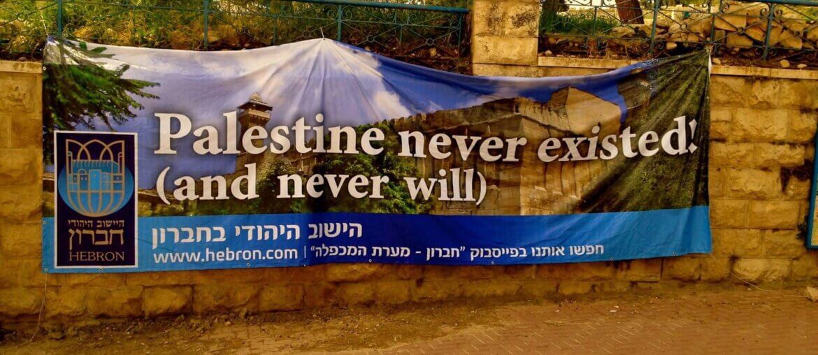 A banner hung by illegal Israeli settlers in the occupied West Bank city of Hebron. (Photo: Twitter/@ronanburtenshaw)