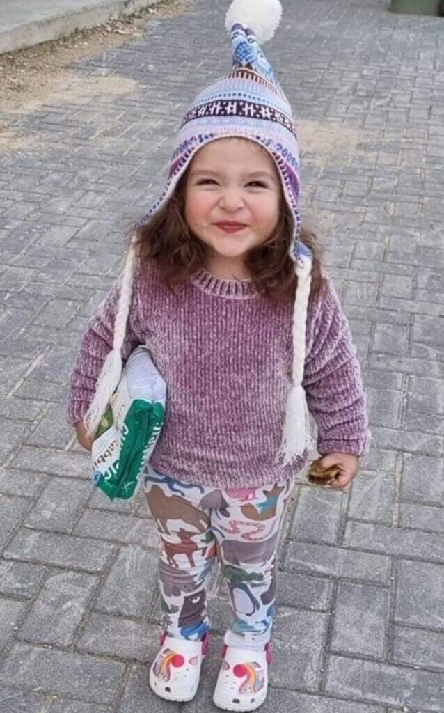 A photo showing Milad Daqqah, smiling and wearing winter clothes as she looks at the camera.