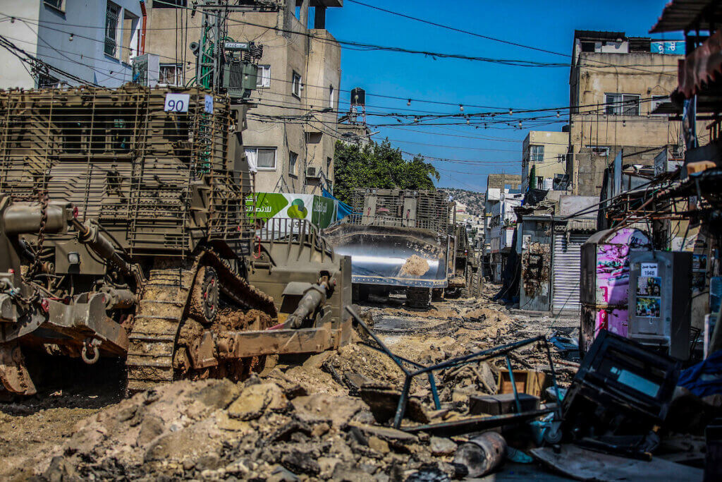 Israeli military bulldozers seen leveling roads and destroying the center of the Jenin refugee camp during a raid on the camp near the West Bank city of Jenin, July 3, 2023. (Photo: Nasser Ishtayeh/SOPA Images via ZUMA Press Wire/APA Images)