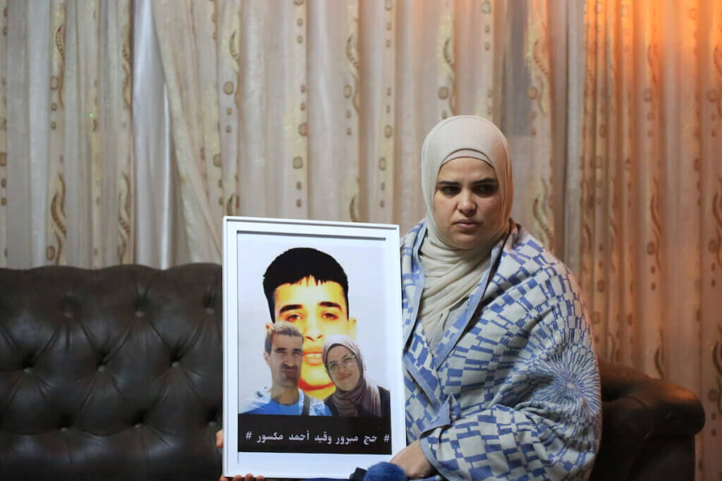 Ahmad Manasra's mother, Maysoon, sits inside her East Jerusalem home following one of Ahmad's court appearances, on November 14, 2022. (Photo: Saeed Qaq/APA Images)