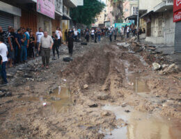 A narrow muddy street in Nur Shams refugee camp is dug up with deep trenches in the aftermath of an Israeli army raid on the camp the previous night.