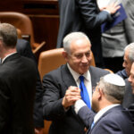 Benjamin Netanyahu shakes hands with Itamar Ben-Gvir during the swearing in of the 37th government of Israel under the authority of Prime Minister Benjamin Netanyahu.