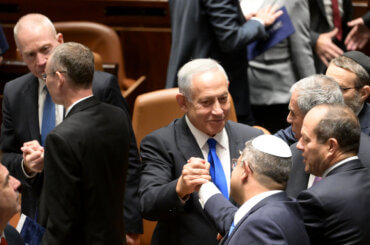 Benjamin Netanyahu shakes hands with Itamar Ben-Gvir during the swearing in of the 37th government of Israel under the authority of Prime Minister Benjamin Netanyahu.