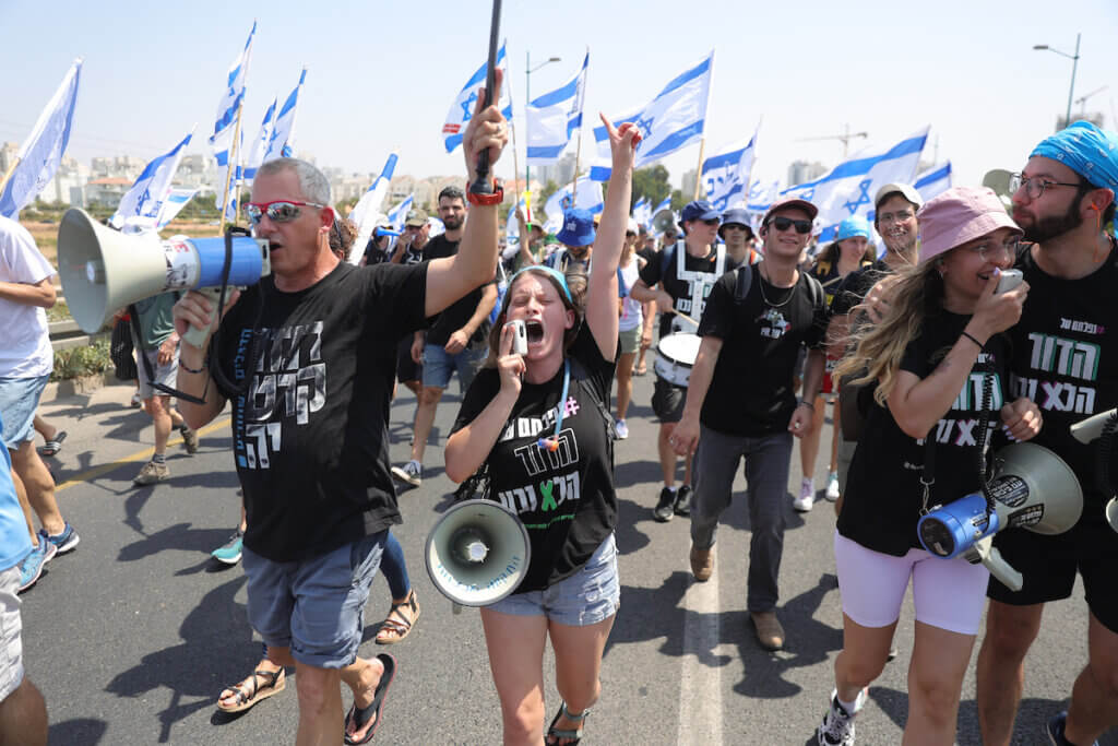 Israeli protesters march against justice system reform, ahead of Prime Minister Benjamin Netanyahu's arrival to an inauguration ceremony of the new light rail in Petah Tikva, August 17, 2023. (Photo: Abir Sultan/EFE via ZUMA Press APA Images)