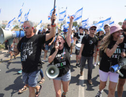Israeli protesters march against justice system reform, ahead of Prime Minister Benjamin Netanyahu's arrival to an inauguration ceremony of the new light rail in Petah Tikva, August 17, 2023. (Photo: Abir Sultan/EFE via ZUMA Press APA Images)