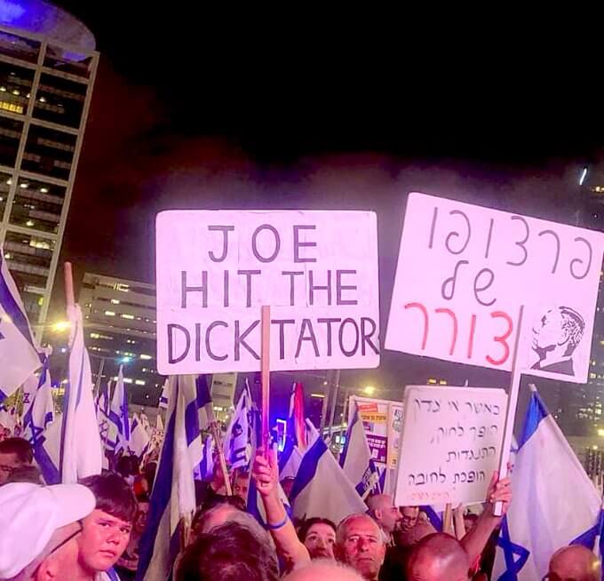 Tel Aviv demonstration August 26 features poster appealing to Joe Biden to take on Netanyahu, and another saying, "the face of a dictator" in Hebrew. From Noga Tarnopolsky's twitter feed, Aug. 26, 2023.