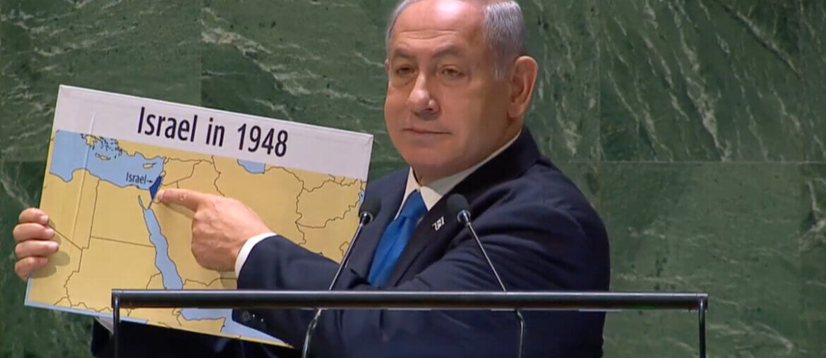 Israeli PM Benjamin Netanyahu holds up map that erases Palestine. UN General Assembly, 22 September 2023 (YouTube)