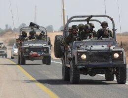 Israeli soldiers drive along the border with Gaza near the southern city of Ofakim, October 11, 2023.