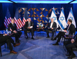 U.S. President Joe Biden visits Israel and meets Israeli Prime Minister Benjamin Netanyahu in Tel Aviv, October 18, 2023. Netanyahu and Biden are seated with the Israeli and American flags behind them, respectively, while each is flanked by their aides and government officials, including U.S. Secretary Antony Blinken.