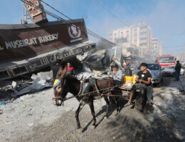 Palestinians and civil defense inspect a destroyed bakery after an airstrike that killed four people in Nuseirat, central Gaza Strip, October 18, 2023.