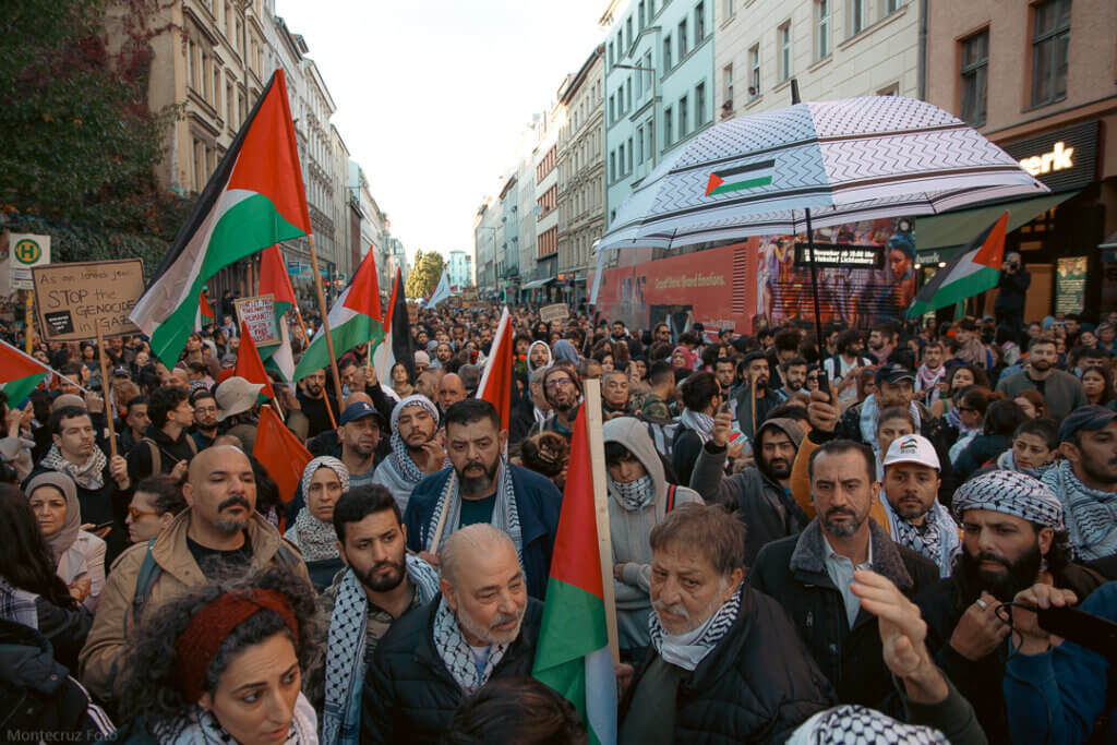Rally in solidarity with Gaza in Kreuzberg, October 21, 2023. Demonstrators carry Palestinian flags as they march.