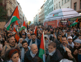 Rally in solidarity with Gaza in Kreuzberg, October 21, 2023. Demonstrators carry Palestinian flags as they march.
