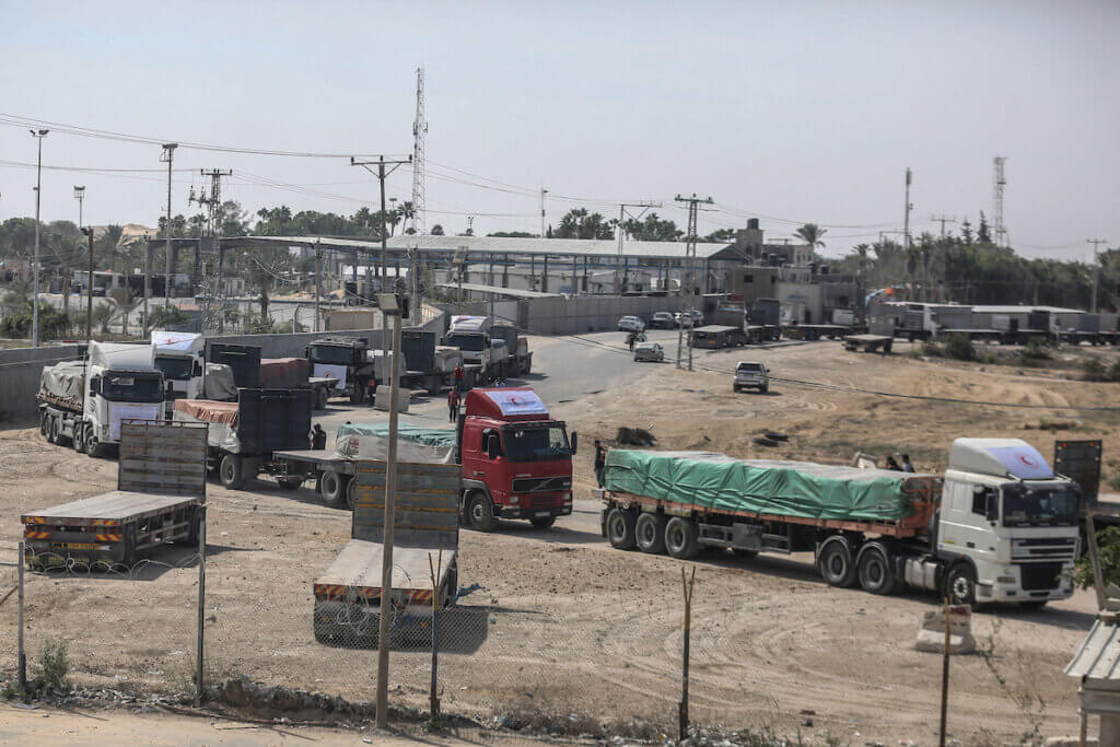 Trucks loaded with aid arrive from the Egyptian side to the Palestinian side at the Rafah border crossing, October 21, 2023
