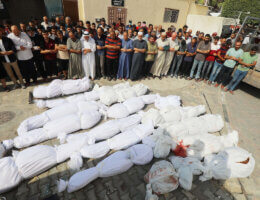 People attend a funeral prayer for a Palestinian family killed during an Israeli airstrike, Al-Aqsa Hospital in Deir al-Balah, October 22, 2023.