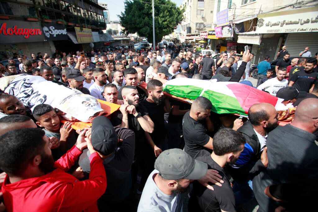 People attend the funeral of two Palestinians killed during an Israeli airstrike on Jenin refugee Camp in Jenin, October 22, 2023.