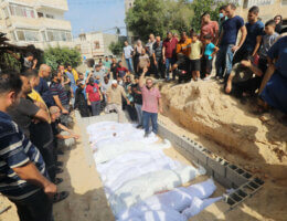 Palestinians bury the Abu Dan Family in a mass grave on Deir al-Balah, central Gaza Strip, October 23, 2023.