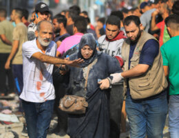 A wounded Palestinian woman is brought to El- Shifa Hospital as civil defense teams and residents conduct a search and rescue operation for Palestinians stuck under the debris of a destroyed building after an Israeli airstrike in Gaza City, on October 25, 2023. (Photo: Saeed Jaras/APA Images)