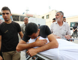 Palestinian relatives wait to collect the bodies of victims at the Al-Aqsa Hospital following an Israeli air strike on Dair El-Balah in Central, Gaza Strip on October 29, 2023. (Photo: Omar Al-Dirawi/APA Images)