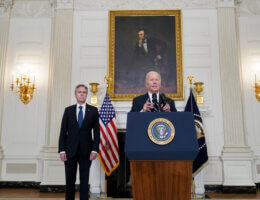 Secretary of State Antony Blinken, left, listens as President Joe Biden speaks in the State Dining Room of the White House, Oct. 7, 2023, in Washington, in support of Israel. (AP Photo/Manuel Balce Ceneta)