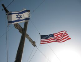 The Israeli and U.S. flags fly a boat sailing from Tiberias to Kibbutz Ginnosar in the Galilee. (Photo: James Emery/Wikimedia)