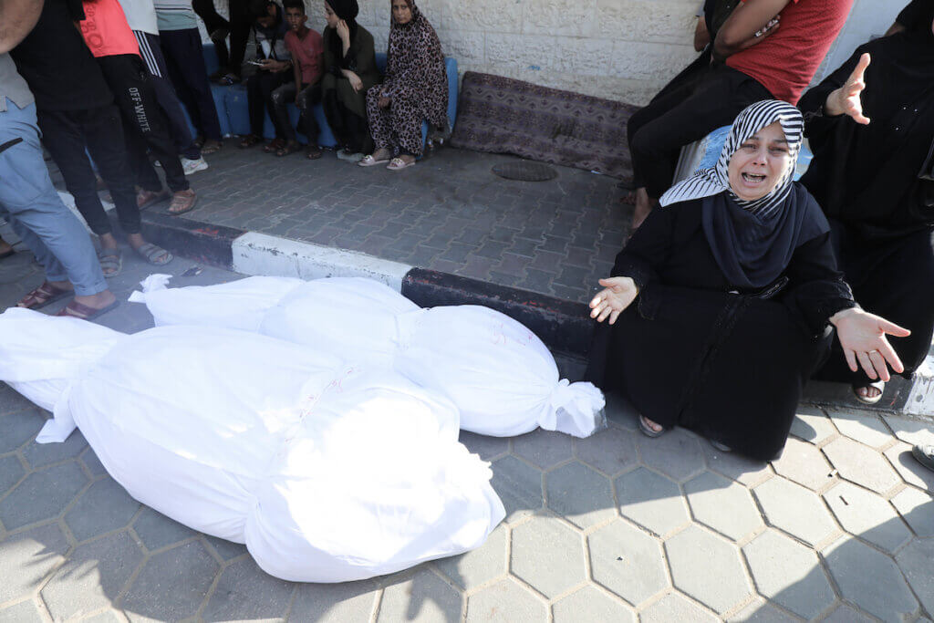Palestinians mourn their relatives outside the morgue of the Aqsa Hospital in Deir El- Balah, Gaza on November 2, 2023. (Photo: Omar Ashtawy/APA Images)