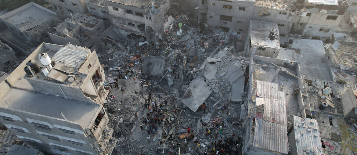 An aerial view of locals conducting search and rescue operations in the rubble of collapsed buildings during the 30th day of Israeli airstrikes, which killed 51 Palestinians in Al-Maghazi refugee camp in Deir Al-Balah, November 05, 2023.