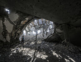 Palestinians inspect the debris at the Khaled Ibn Al-Walid mosque after it was hit by Israeli bombardment in Khan Yunis, southern Gaza, November 9, 2023.