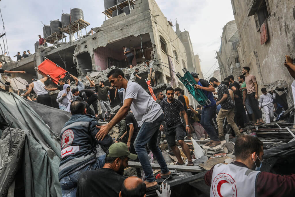 First responders and volunteers search the destroyed house of the Al-Ghouti family following an Israeli airstrike, Rafah, November 11, 2023.