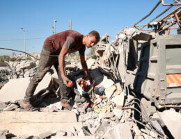 People search through buildings, destroyed during Israeli air strikes a day earlier, in the southern Gaza Strip on November 16, 2023 in Nuseirat, Gaza. (Photo: Bashar Taleb/APA Images)