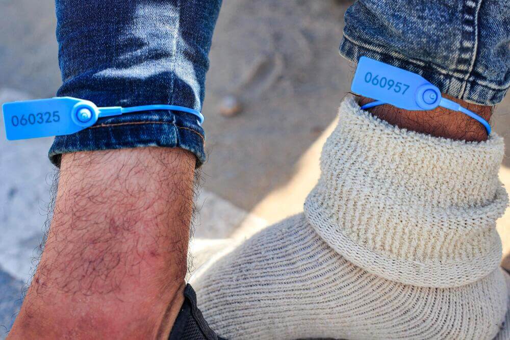 Numbered bracelets placed on Palestinian workers from Gaza.