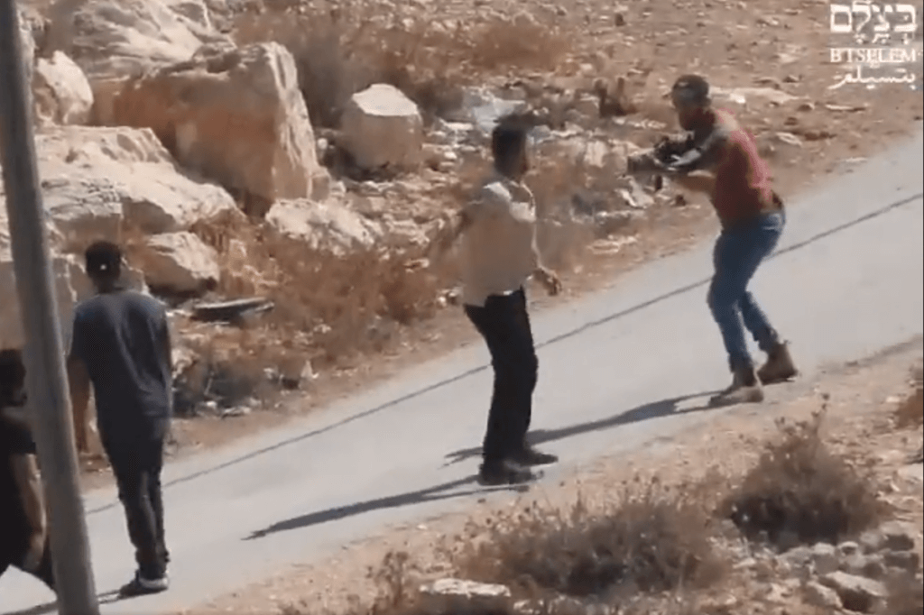 Screenshot from a video published by the Israeli human rights group B'Tselem showing an Israeli settler opening fire on Palestinians in the South Hebron Hills village of Tuwani, October 13, 2023.