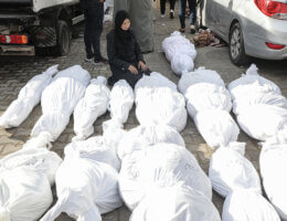 People mourn over the bodies of Palestinians killed in airstrikes on December 10, 2023 in Deir El-Balah, Gaza. (Photo: Omar Ashtawy/APA Images)