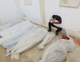Palestinians mourn as they collect the bodies of loved ones killed in Israeli airstrikes on December 18, 2023, at Al-Aqsa hospital in Deir El-Balah, Gaza Strip. (Photo: Omar Ashtawy/APA Images)