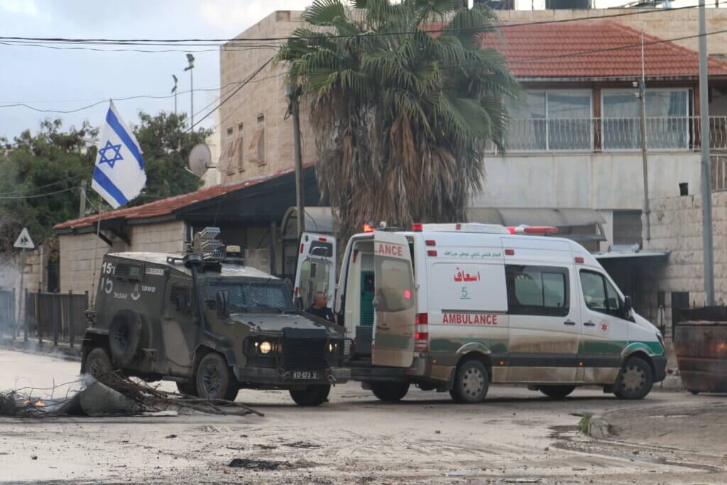 Israeli army stops and searches ambulances during a raid of Jenin refugee camp (Photo: Shatha Hanaysha)