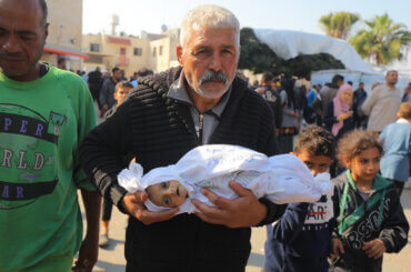 Dead body of a 5-month-old Palestinian baby named Muhammad Hani Al-Zahar, is brought to the Al-Aqsa Martyrs Hospital by his mother Asmahan Attia Al-Zahar and grandfather Attia Abu Amra after the Israeli airstrikes at the end of the humanitarian pause in Deir Al-Balah, Gaza on December 1, 2023. 32 Palestinians were killed within 3 hours of the end of the humanitarian pause in Gaza. Photo by Omar Ashtawy apaimages