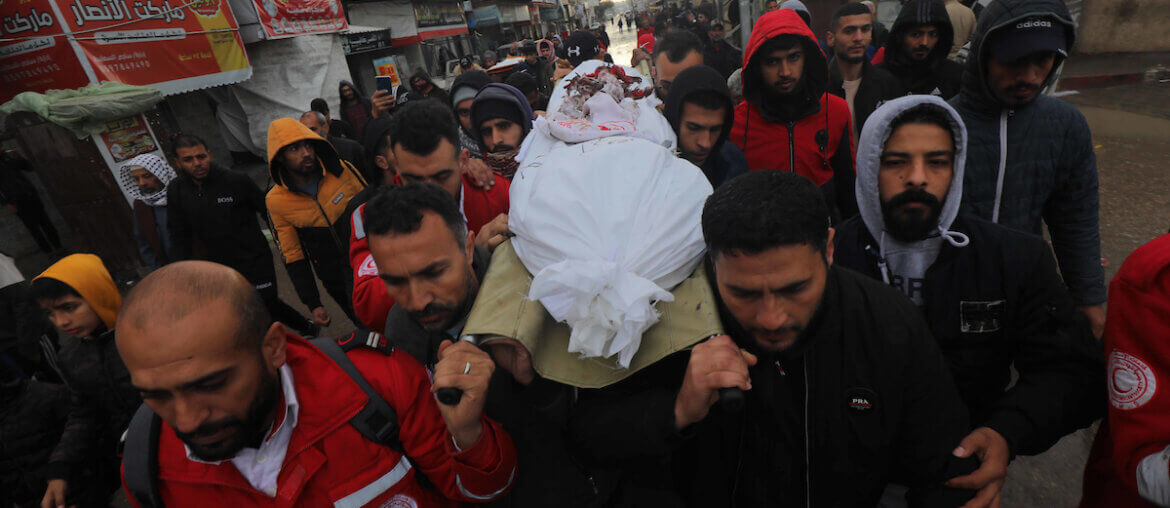 Palestinians attend the funeral of medical personnel killed by an Israeli army attack on an ambulance in Deir al-Balah, Gaza. (Photo: Naaman Omar/APA Images)