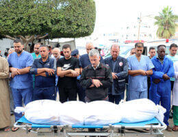 Palestinian doctors perform funeral prayers for the director of Al-Wafa Hospital, Medhat Muhaisen, who was killed in an Israeli air strike on Al-Aqsa Hospital in Deir al-Balah in central Gaza, November 18, 2023. (Photo: Omar Al-Dirawi/APA Images)