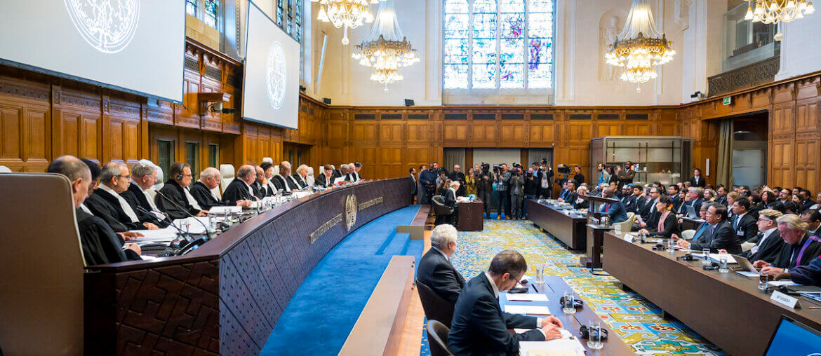 The International Court of Justice (ICJ) courtroom, on December 10, 2019, the opening day of the hearings in the case concerning the Application of the Convention on the Prevention and Punishment of the Crime of Genocide (The Gambia v. Myanmar) (Photo: UN Photo/CIJ-ICJ/Frank van Beek. Courtesy of the ICJ. All rights reserved.)