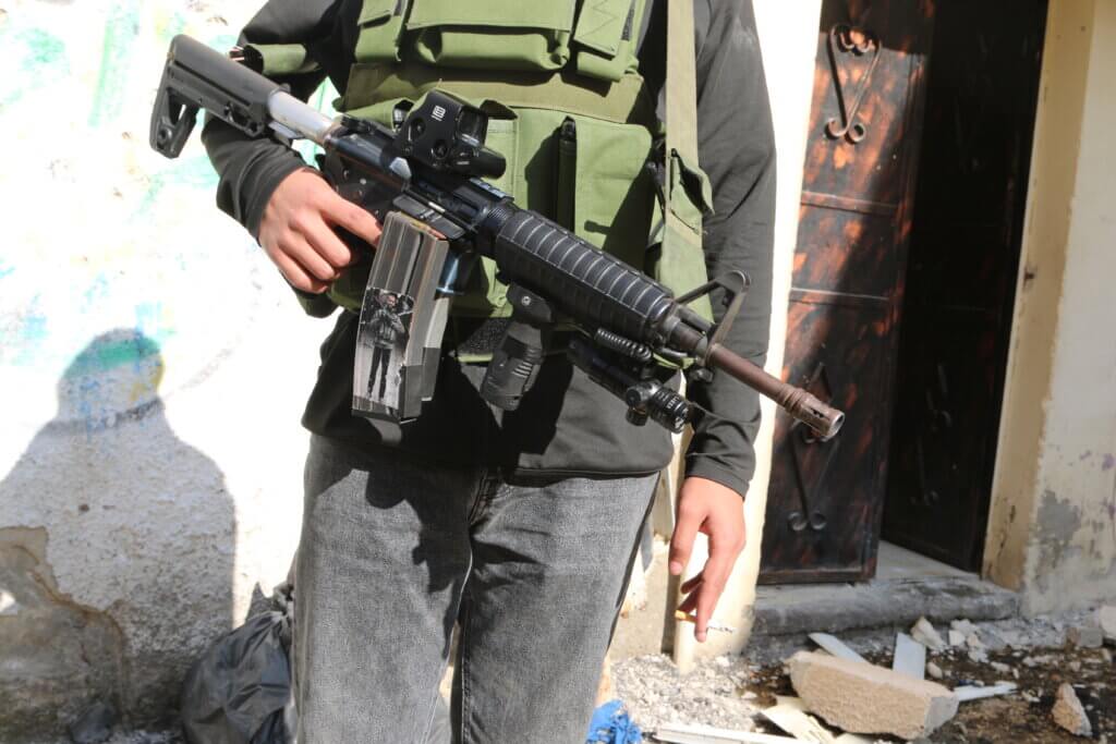 A Palestinian resistance fighter from the Tulkarem Brigade in Nour Shams refugee camp, December 31, 2023. (Photo: Shatha Hanaysha)