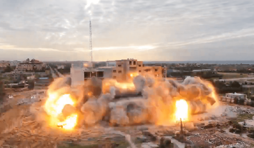 Israeli forces blow up al-Isra University in Gaza on Jan. 17, 2024 in what appears to be planned demolition. Video posted by Hisham Abu Shaqrah. Screenshot.