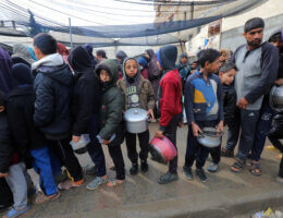 Palestinians stand in line for food aid, Deir al-Balah, February 2, 2024. (Photo: Omar Ashtawy/APA Images)