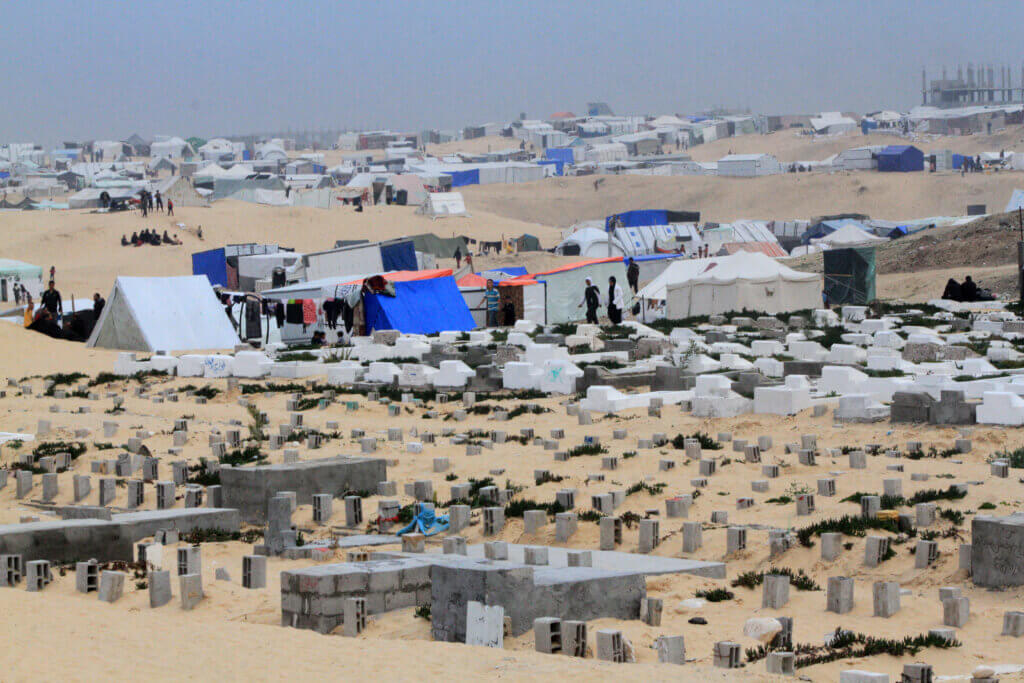 Tents of displaced Palestinians across sand dunes on the outskirts of Rafah in the southern Gaza Strip