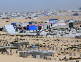 Tents of displaced Palestinians across sand dunes on the outskirts of Rafah in the southern Gaza Strip
