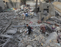 Palestinians inspect the wreckage of buildings destroyed in an Israeli attack on Deir El-Balah, Gaza on February 18, 2024. (Photo: Omar Ashtawy/APA Images)
