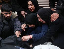Palestinian women grieve over the bodies of their loved ones killed in Israeli airstrikes in Deir Al-Balah, in the central Gaza Strip.