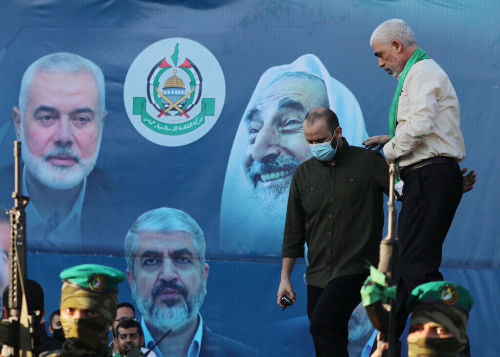 Yahya Sinwar, leader of the Palestinian Hamas movement, greets supporters during a rally in Gaza City on May 24, 2021. Behind Sinwar hangs a banner with current and former Hamas leaders Ismail Haniyeh, Khaled Mashal, and Sheikh Ahmed Yassin. (Photo: Ashraf Amra/APA Images)