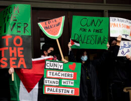 Protesters holding a sign that says, 'CUNY teachers stand with Palestine.'