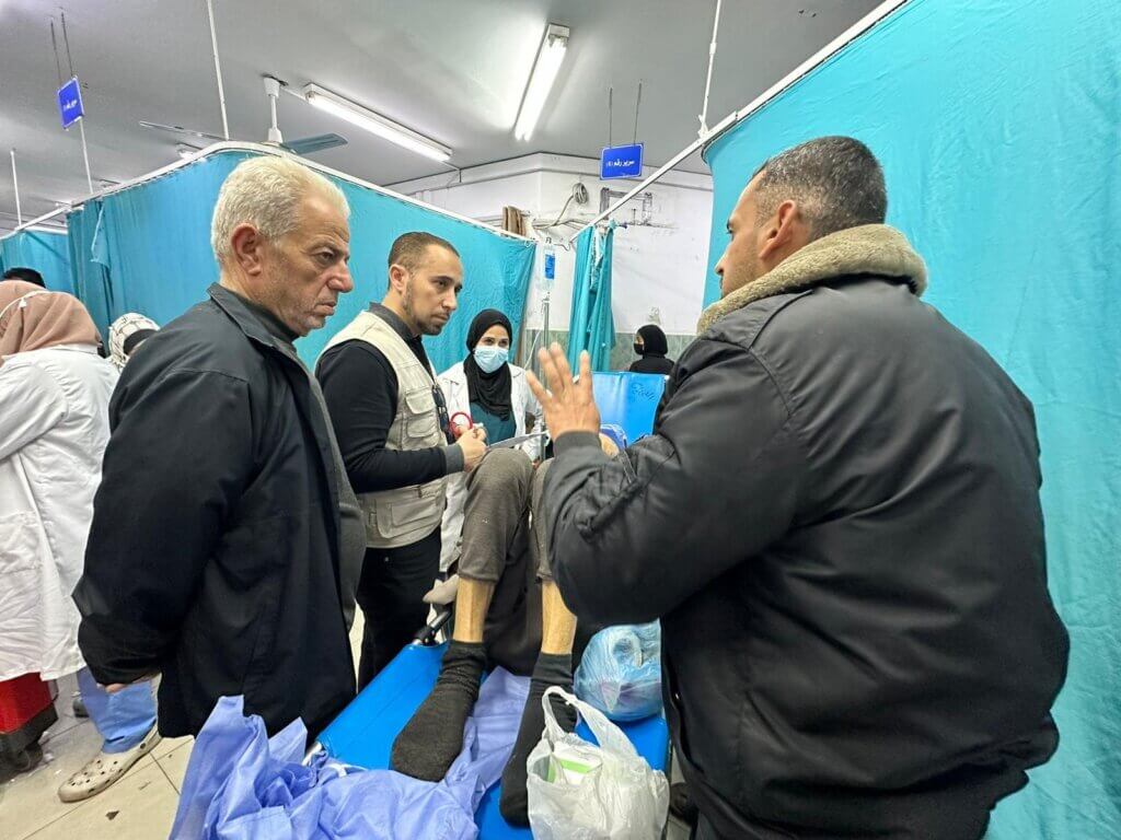 Dr. Yousef Khelfa, second from left, attending to patients at the European Hospital in Khan Younis in February 2024.