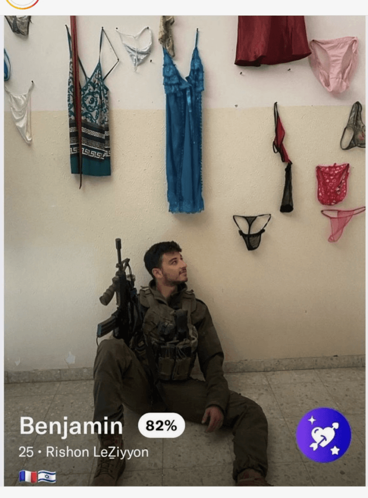An occupation soldier poses with Palestinian women's lingerie inside a Palestinian home in Gaza. Photo: Social media.