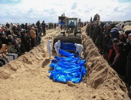 Palestinians bury the bodies of 48 Palestinians, handed over by the Israeli army through the Kerem Shalom border crossing, in a mass grave in the city of Rafah, on March 7, 2024. (Photo: © Mohammed Talatene/dpa via ZUMA Press APA Images)